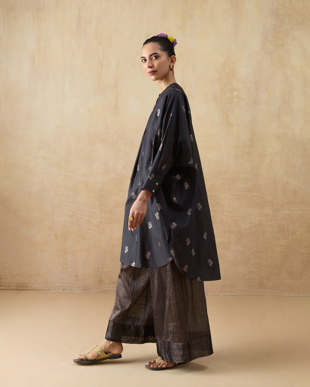 Side view of a charcoal floral Lazy Sunday tunic set with wide-leg pants.