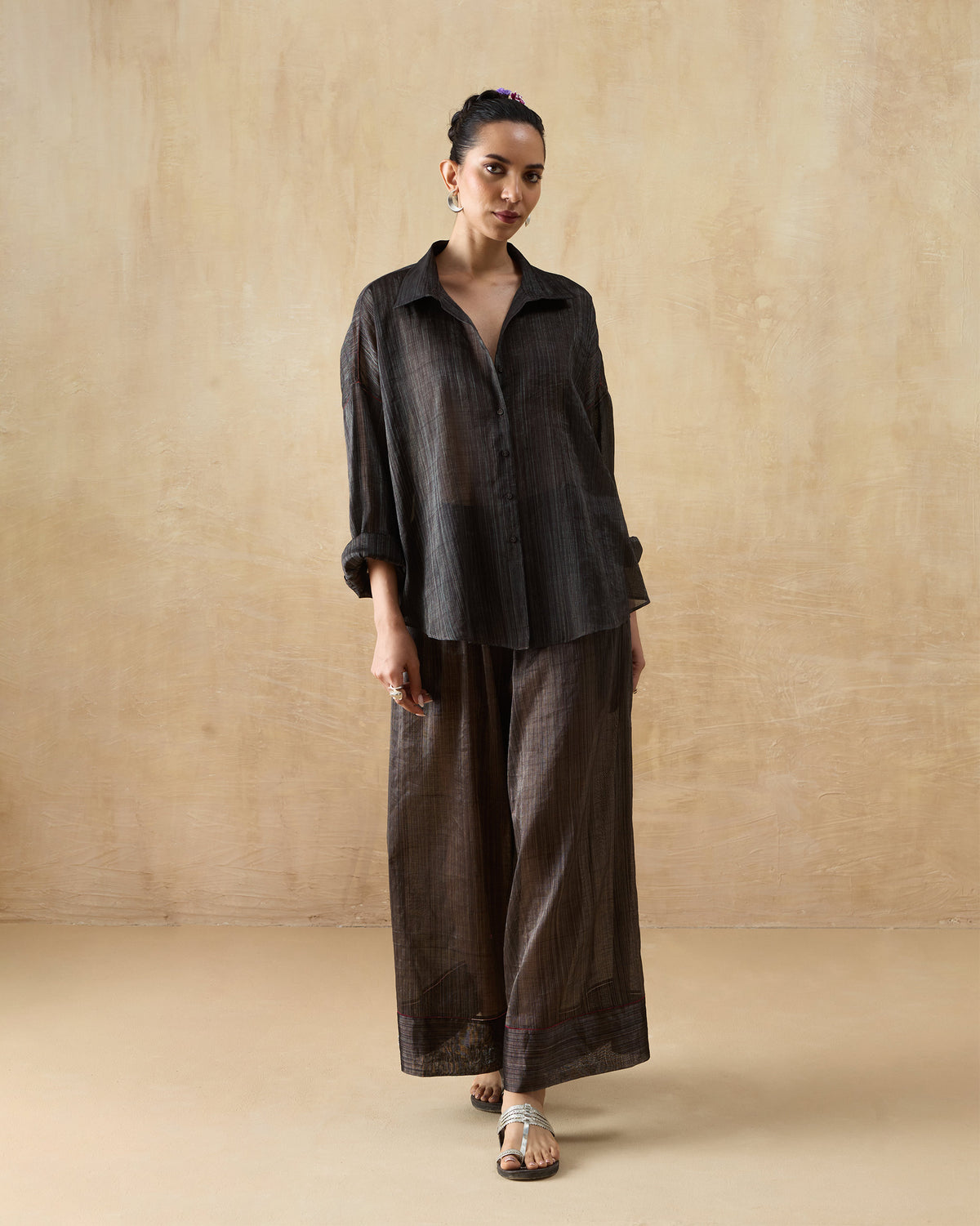 Person wearing the Firefly Shirt Set in dark charcoal with a relaxed shirt and wide trousers.