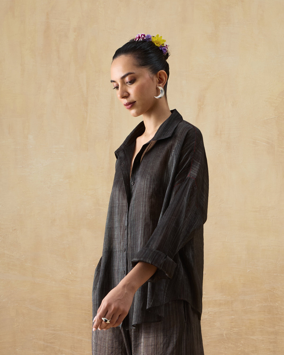 Side view of the Firefly Shirt Set's relaxed shirt with rolled-up sleeves.