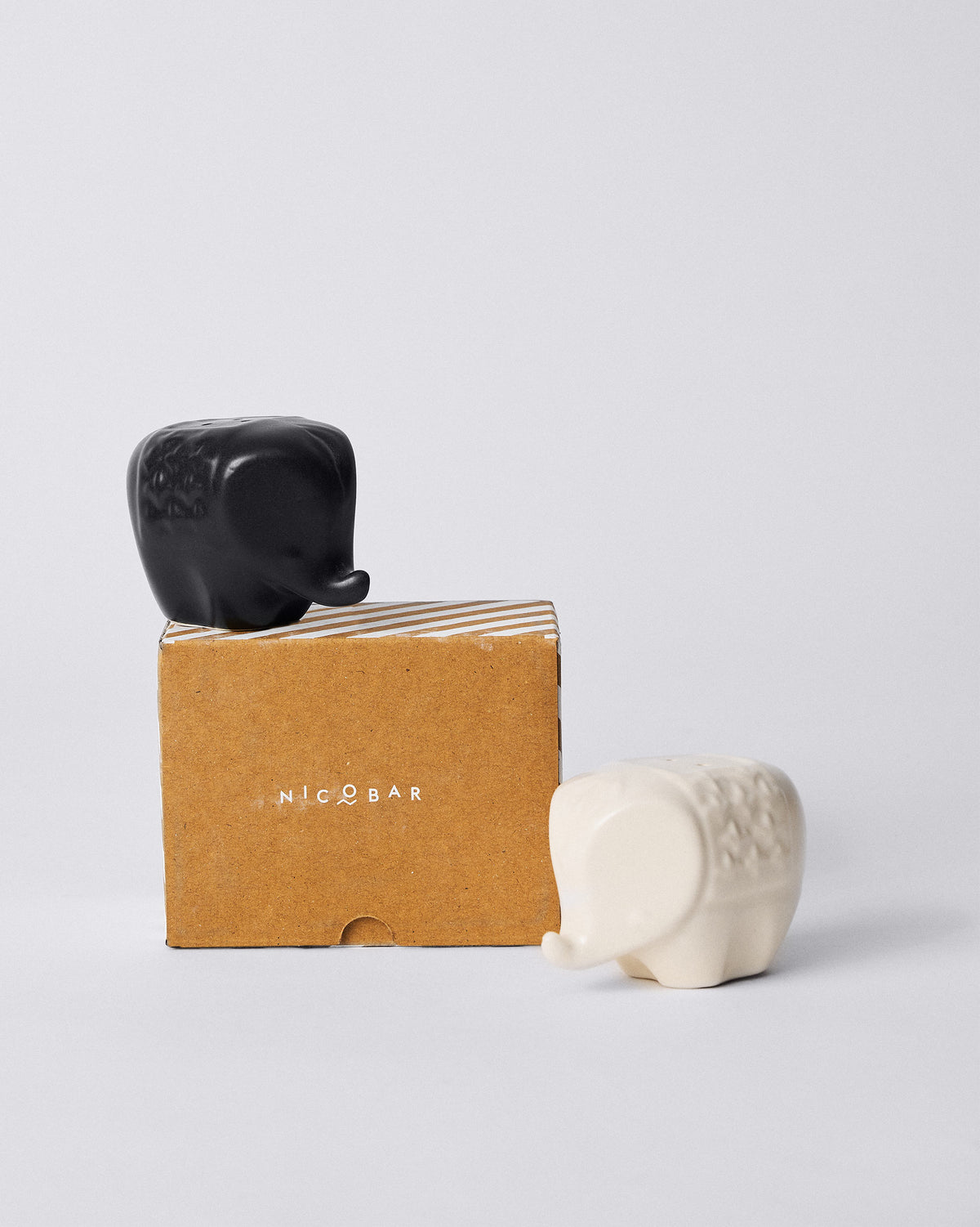 Hathi elephant shakers with a brown Nicobar gift box.