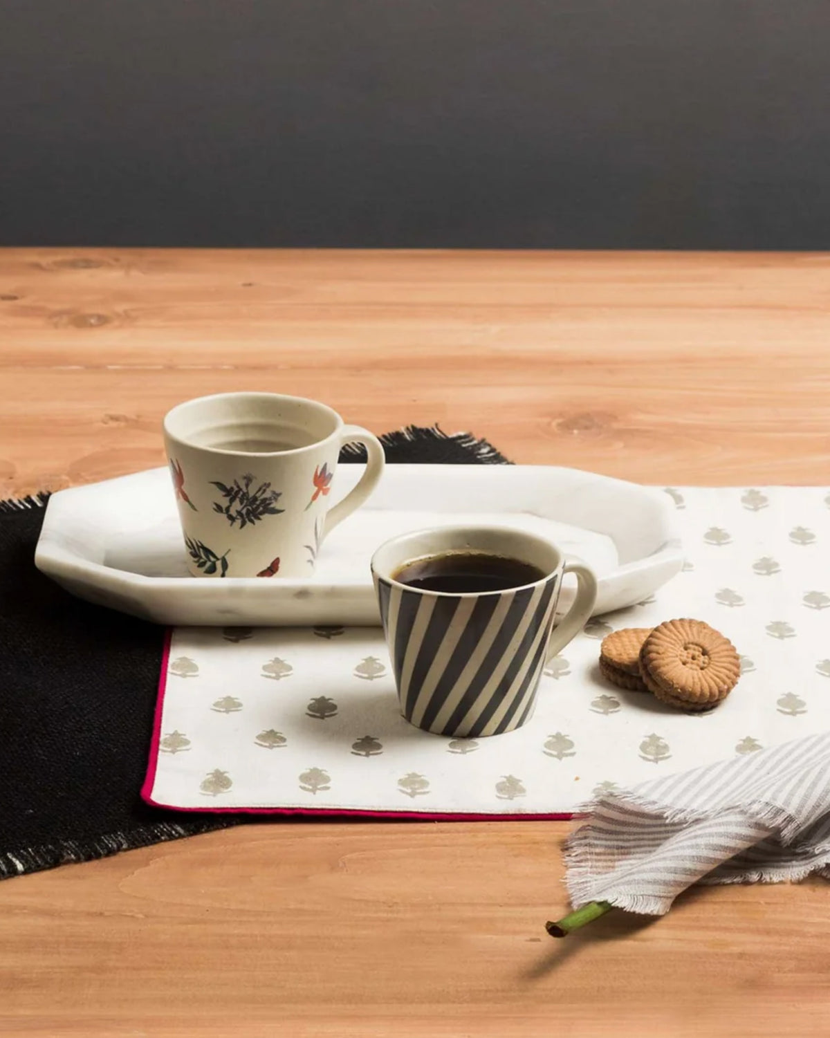 Nanjing espresso mugs in stripe and blossom prints set with coffee and cookies.