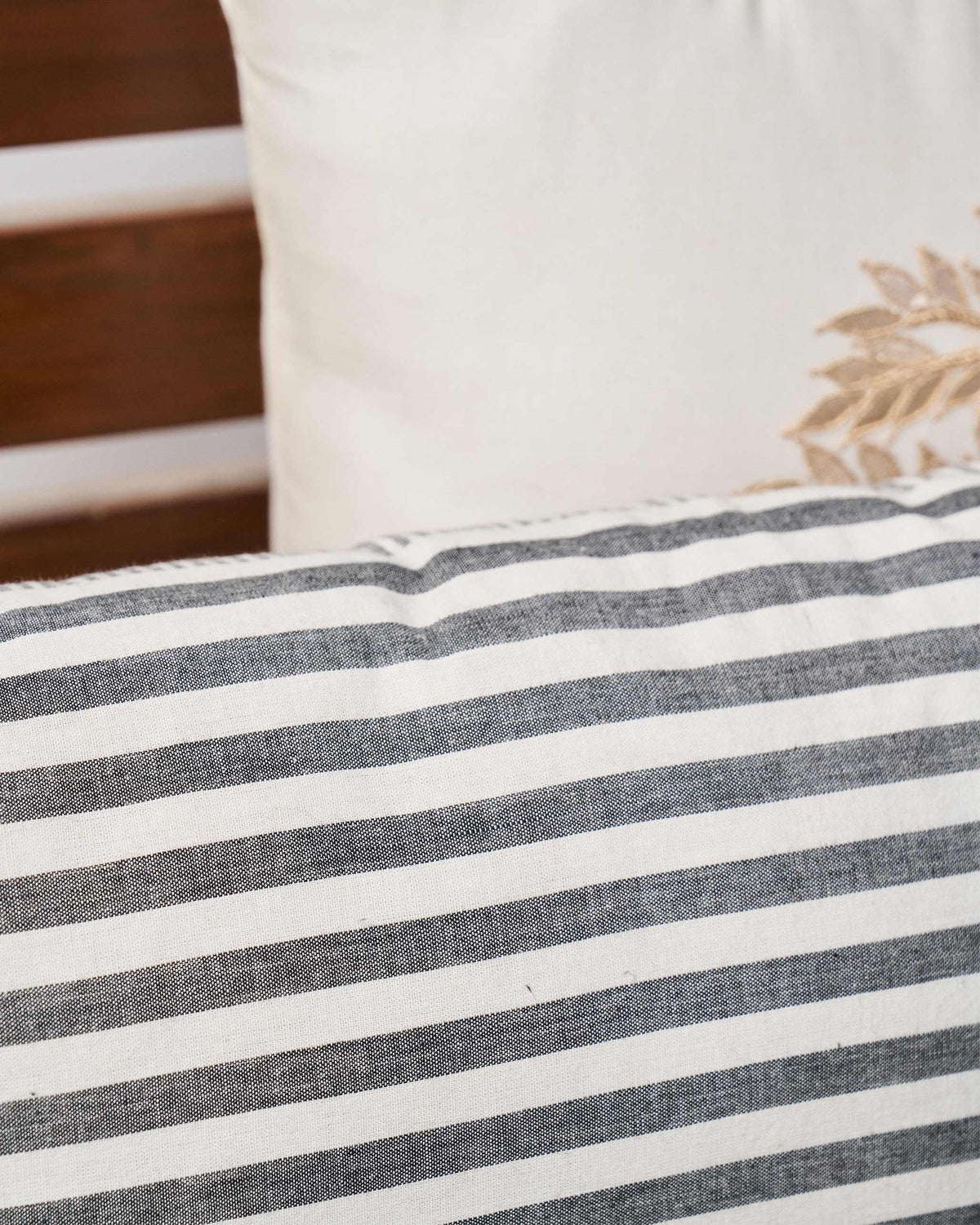 Close-up of Black & White pillow cover with a fringed edge.
