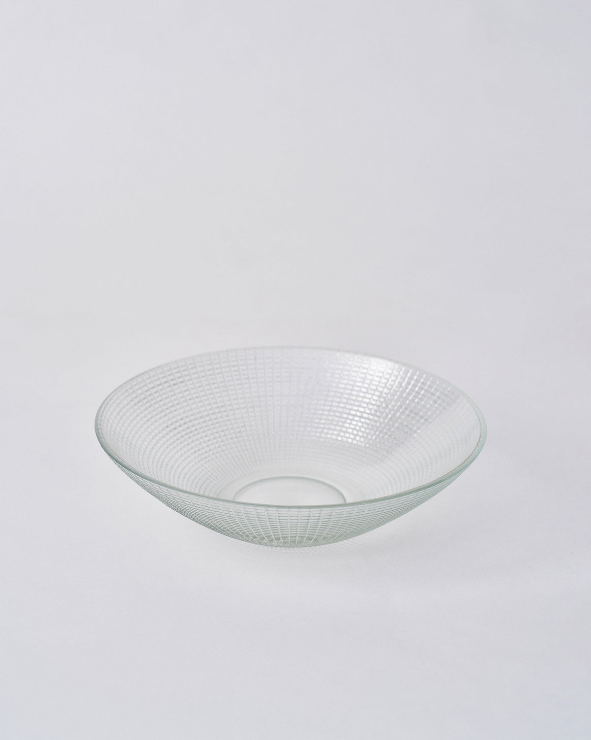 Clear Aire serving bowl showing the etched grid pattern around its shallow sides.