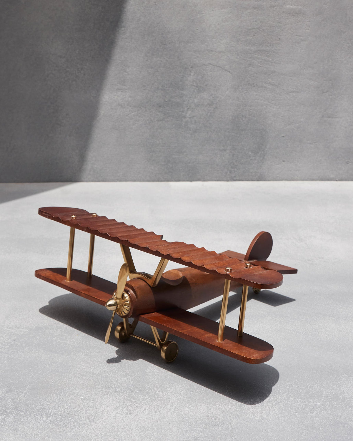 Wood and brass Beufort biplane with a scalloped top wing.