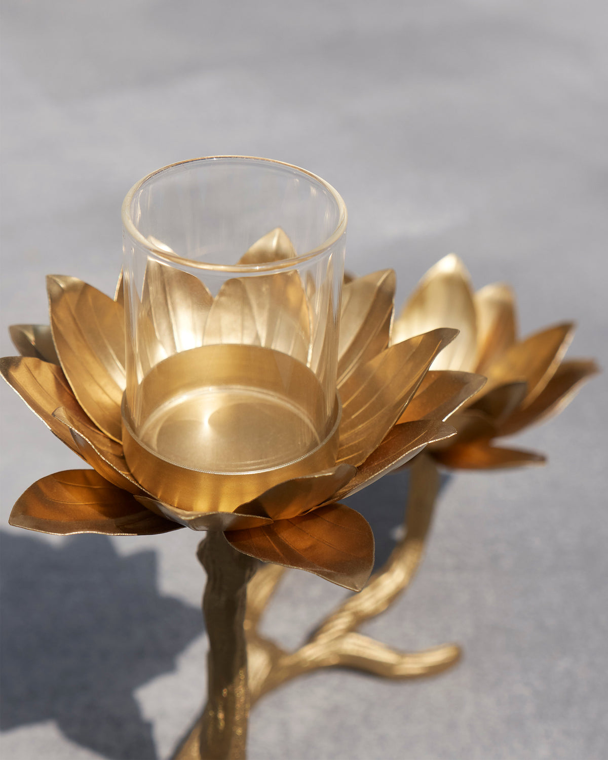Close-up of a Kamal lotus cup with clear glass tealight insert.
