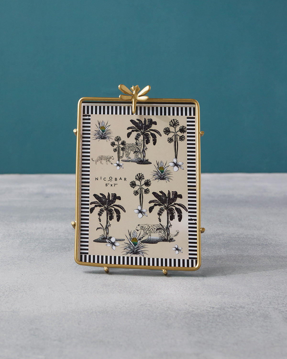 Gold Nizara 5x7 photo frame with a dragonfly ornament and tropical insert.