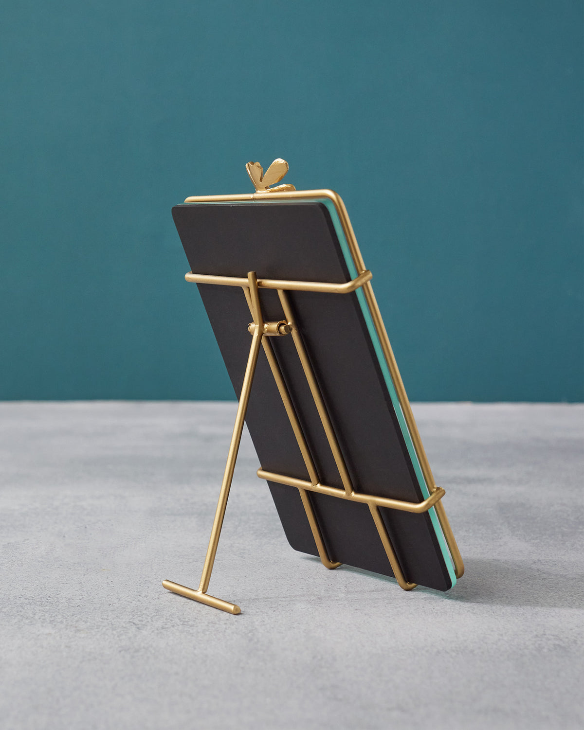 Back of the gold Nizara photo frame showing the wire easel stand.
