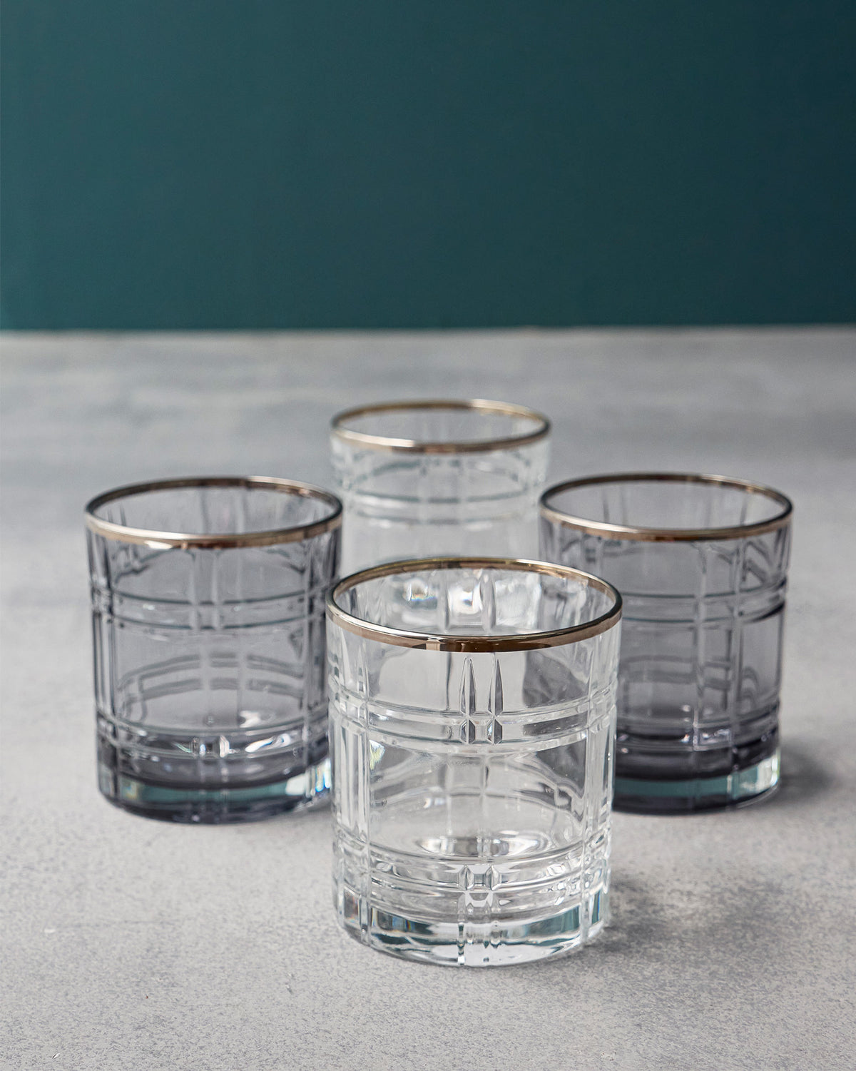 Clear and charcoal Celeste whiskey glasses with platinum rims.