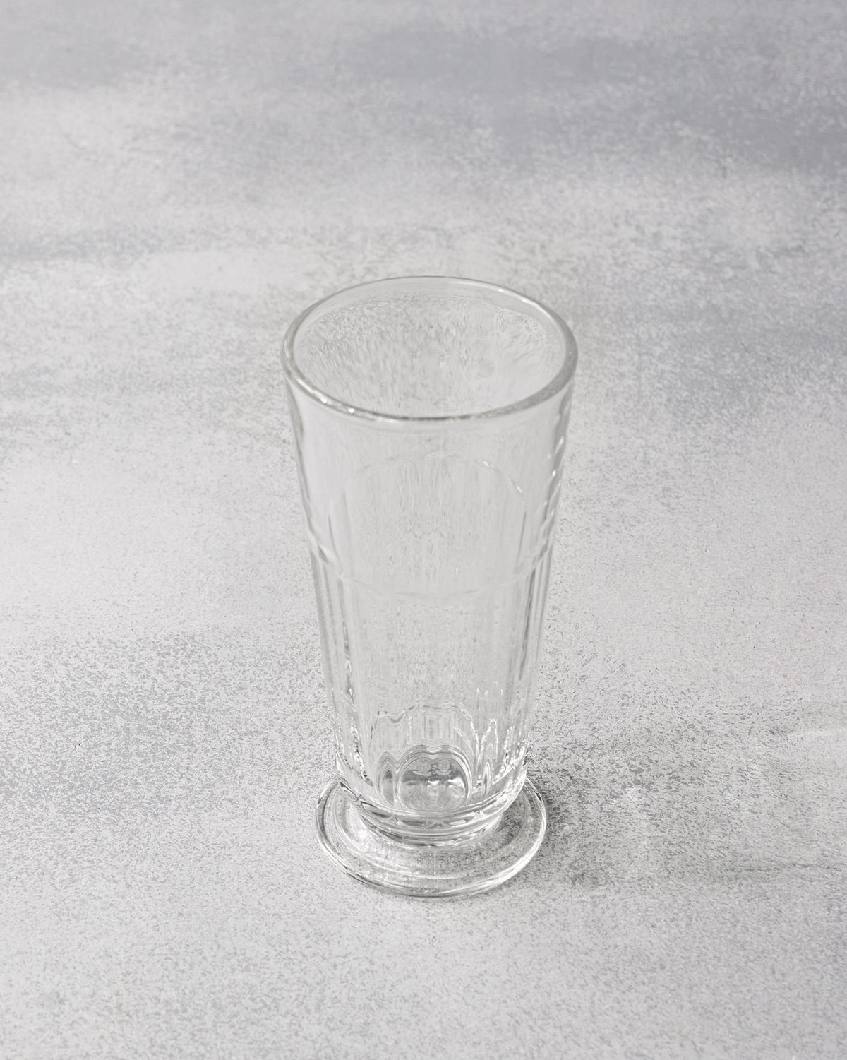 High angle looking into a tall fluted Mahi beer glass.