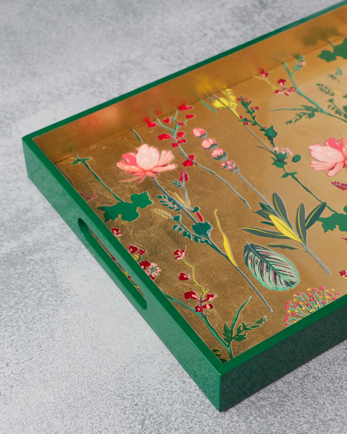 Close-up of the Mahi Rectangle Tray showing pink flowers on gold leaf.