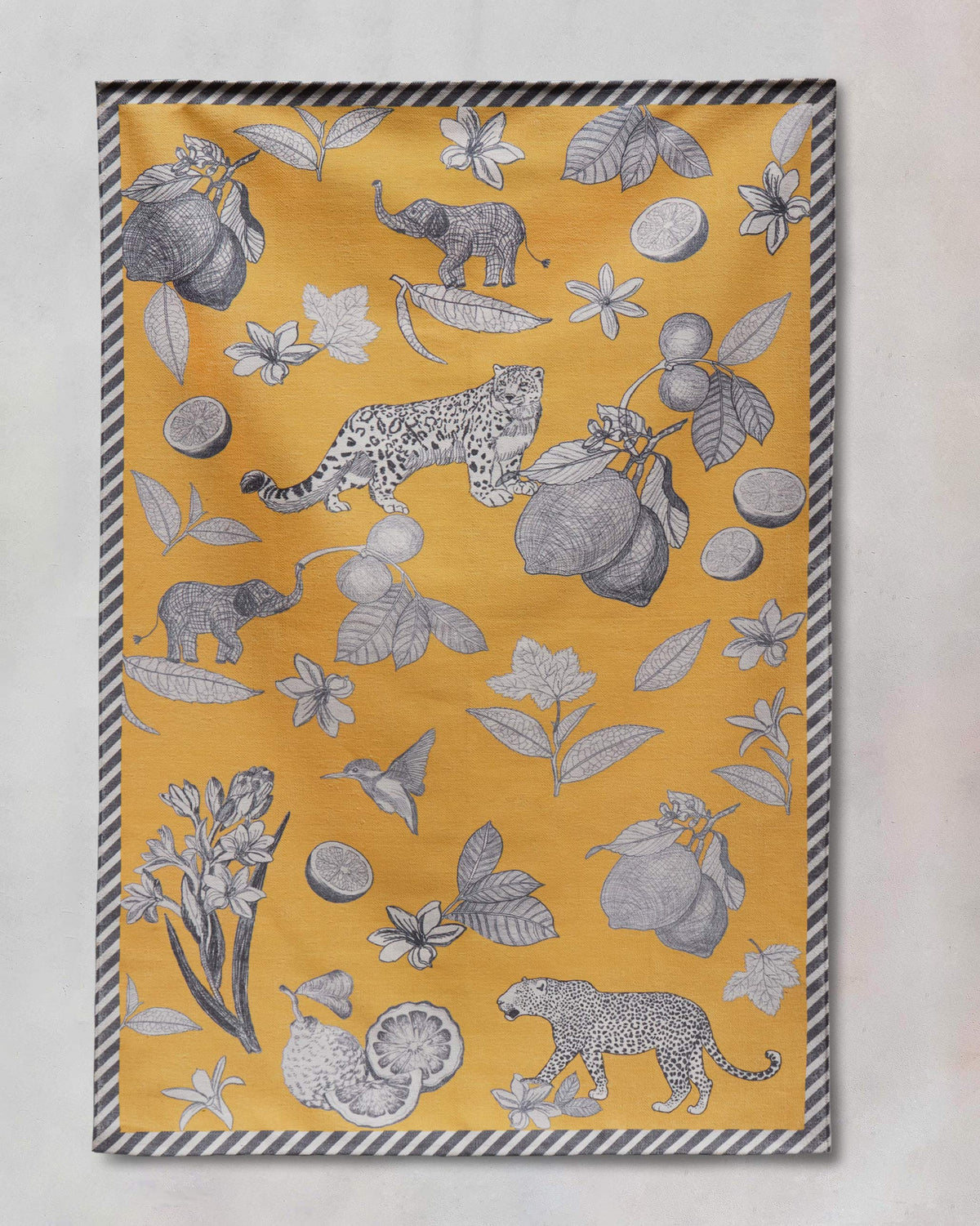 Forest Rug in yellow with navy leopard, elephant and citrus motifs.