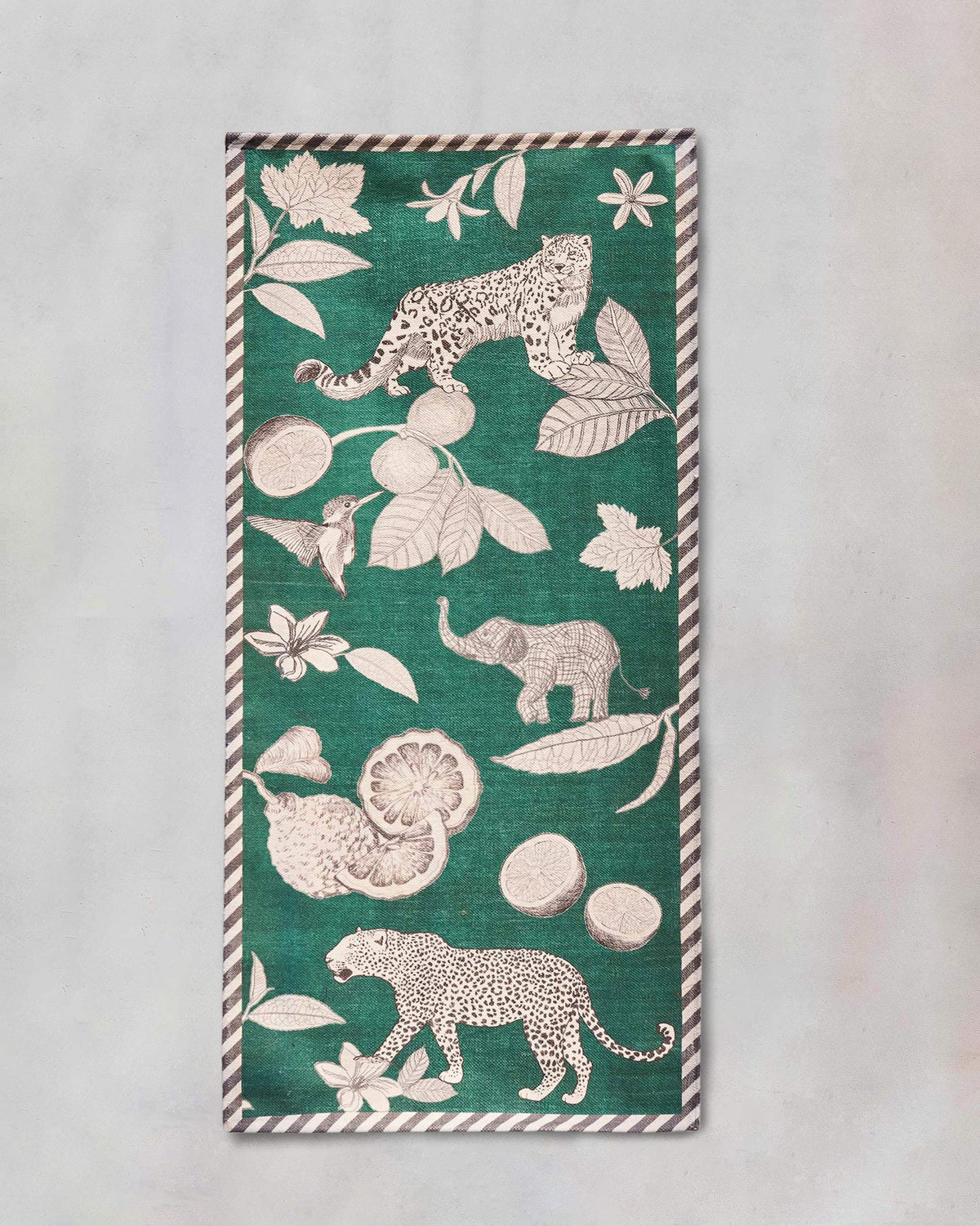 Zaka Rug in green with leopard, elephant and citrus motifs.