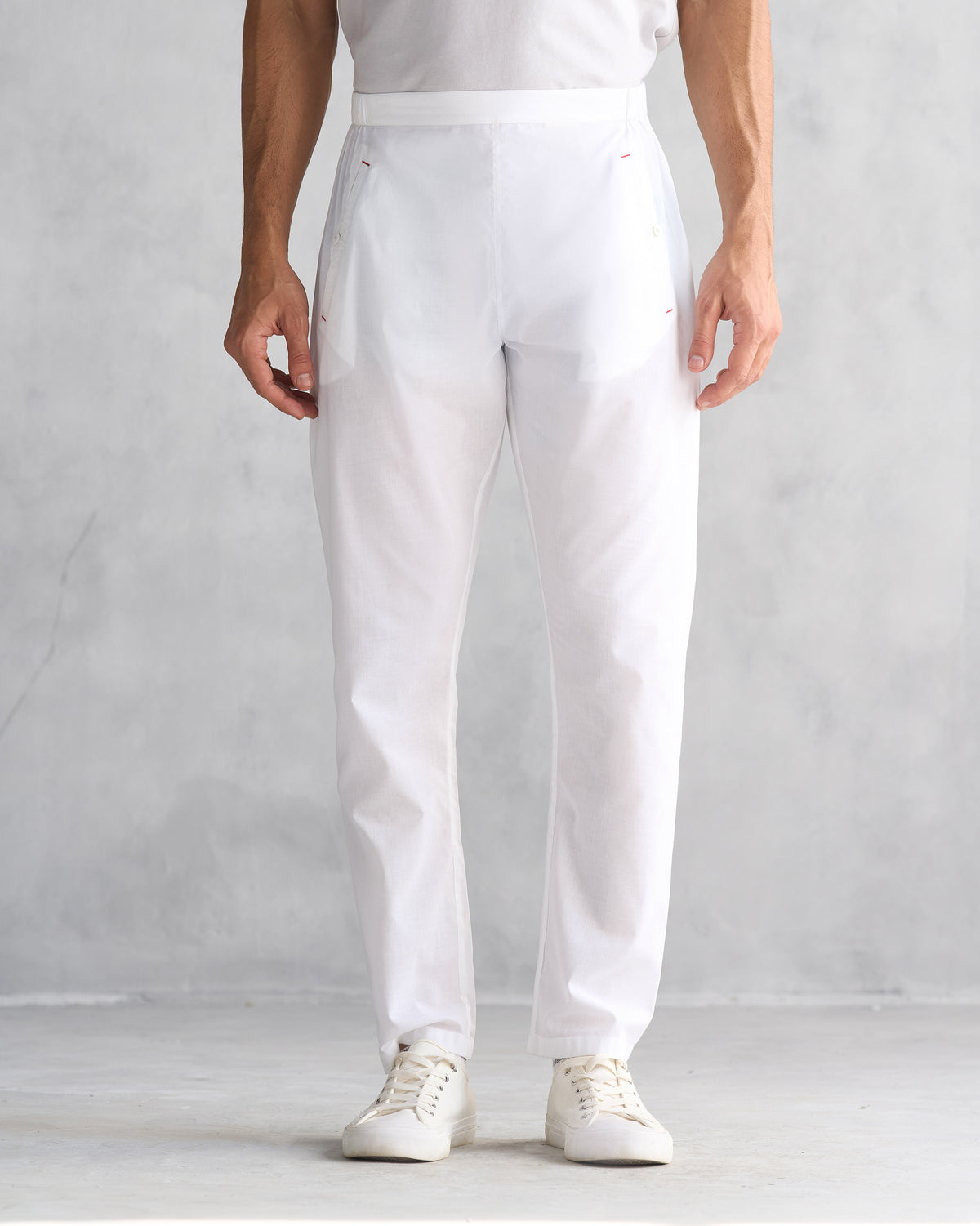 Person wearing white Kurta Pants with an elastic waist.