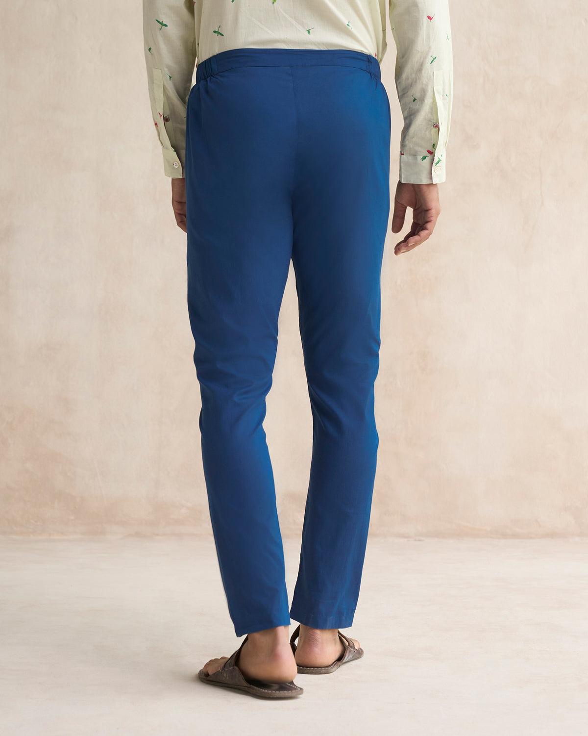 Back of navy Kurta Pants worn by a person.