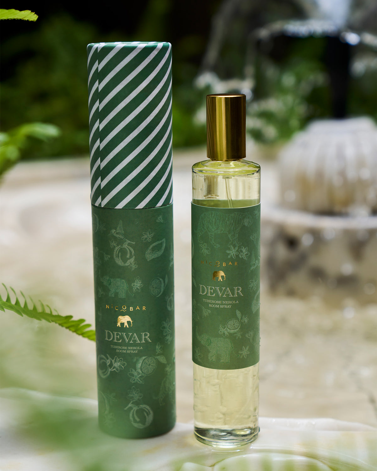Devar Tuberose Neroli room spray bottle beside its green gift tube.