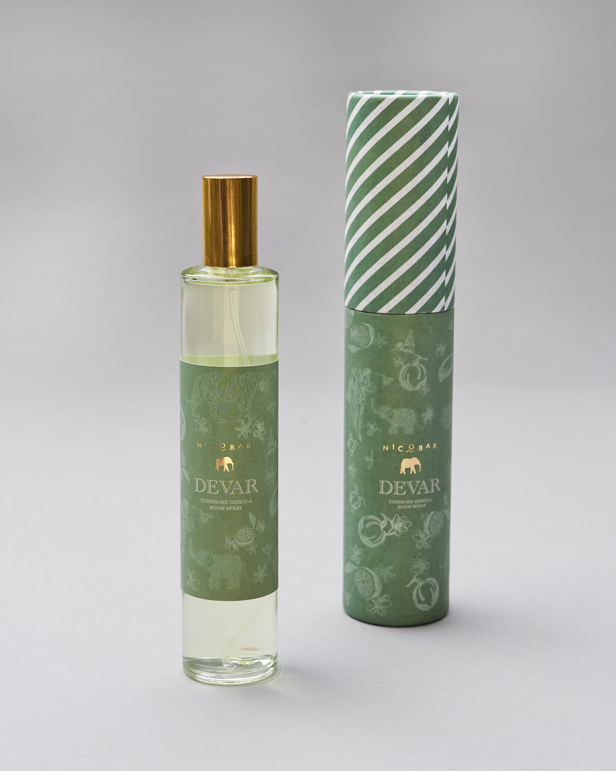 Devar room spray bottle with matching green striped gift tube.