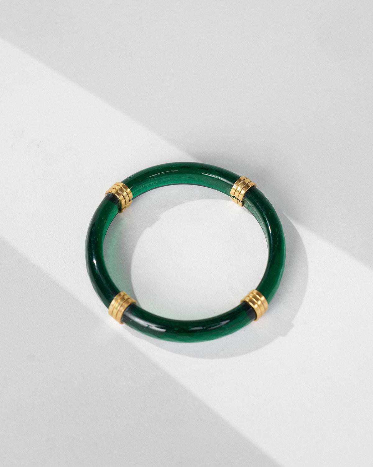 Green Cara bangle from above showing gold spacer bands.