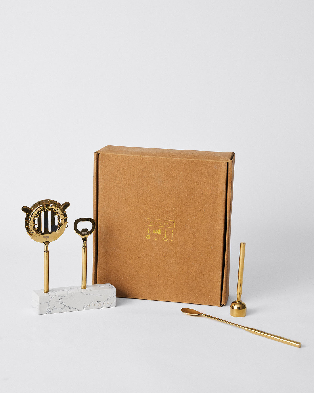 Aurum Bar Tools beside their kraft gift box.