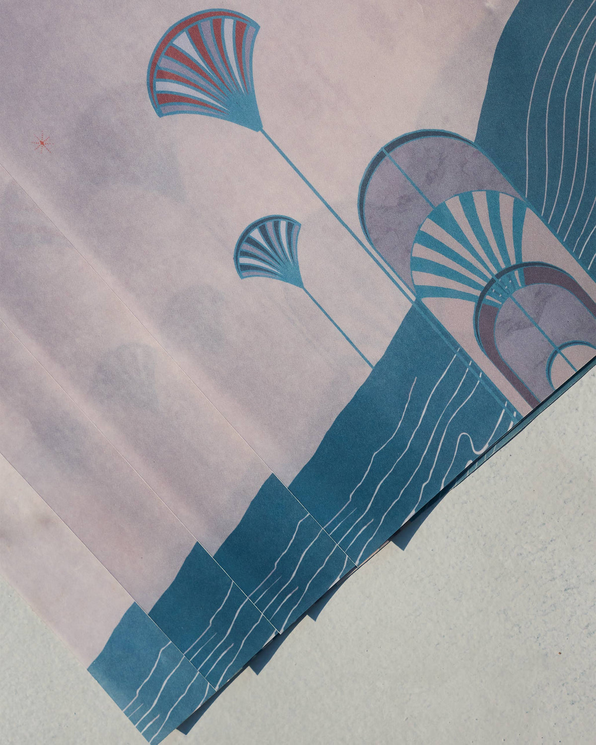 Close-up of Tranquil parchment paper with fan and wave motifs.