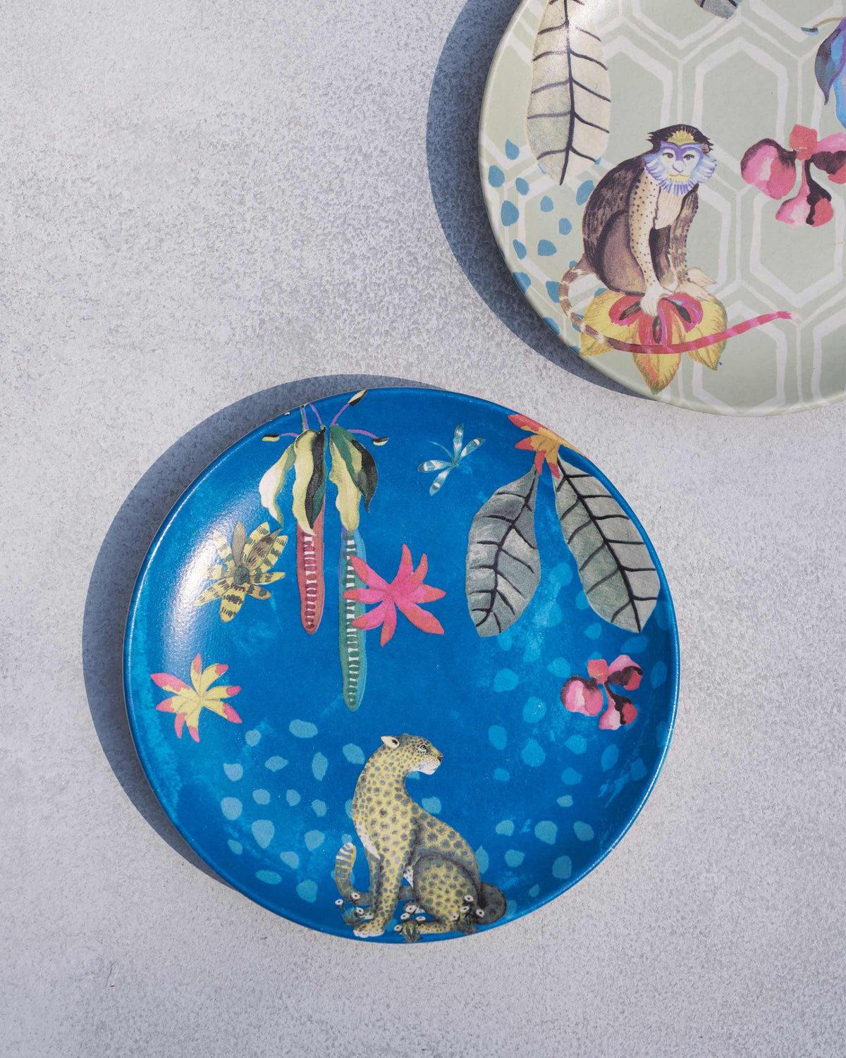 Teal Mahi quarter plate with a leopard among tropical leaves.