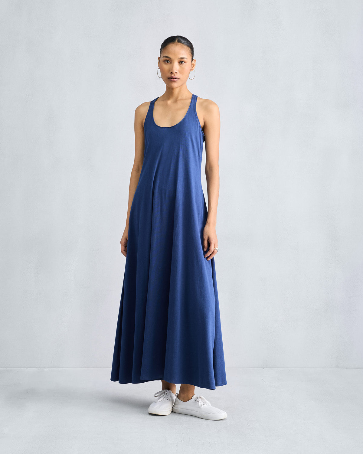 Full view of a navy Esther dress with a flared A-line silhouette.