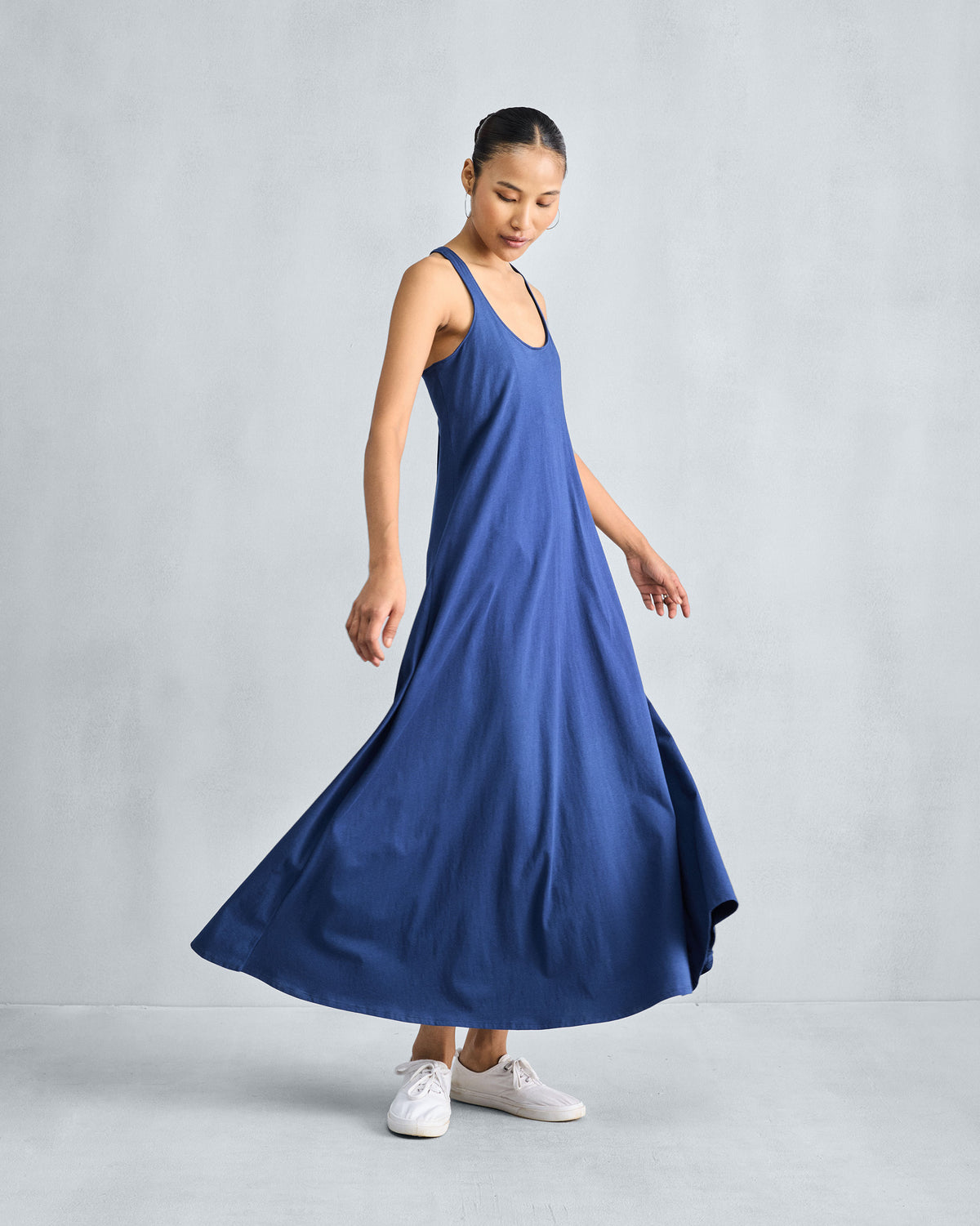 Navy Esther dress showing the flared A-line skirt in motion.