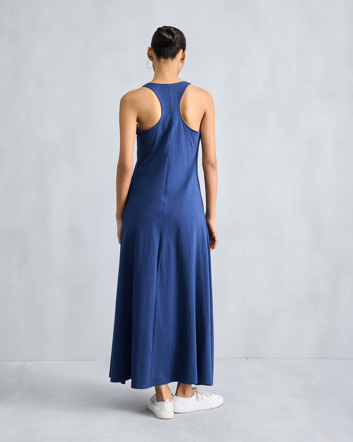 Back of a navy Esther dress with a racerback and centre seam.