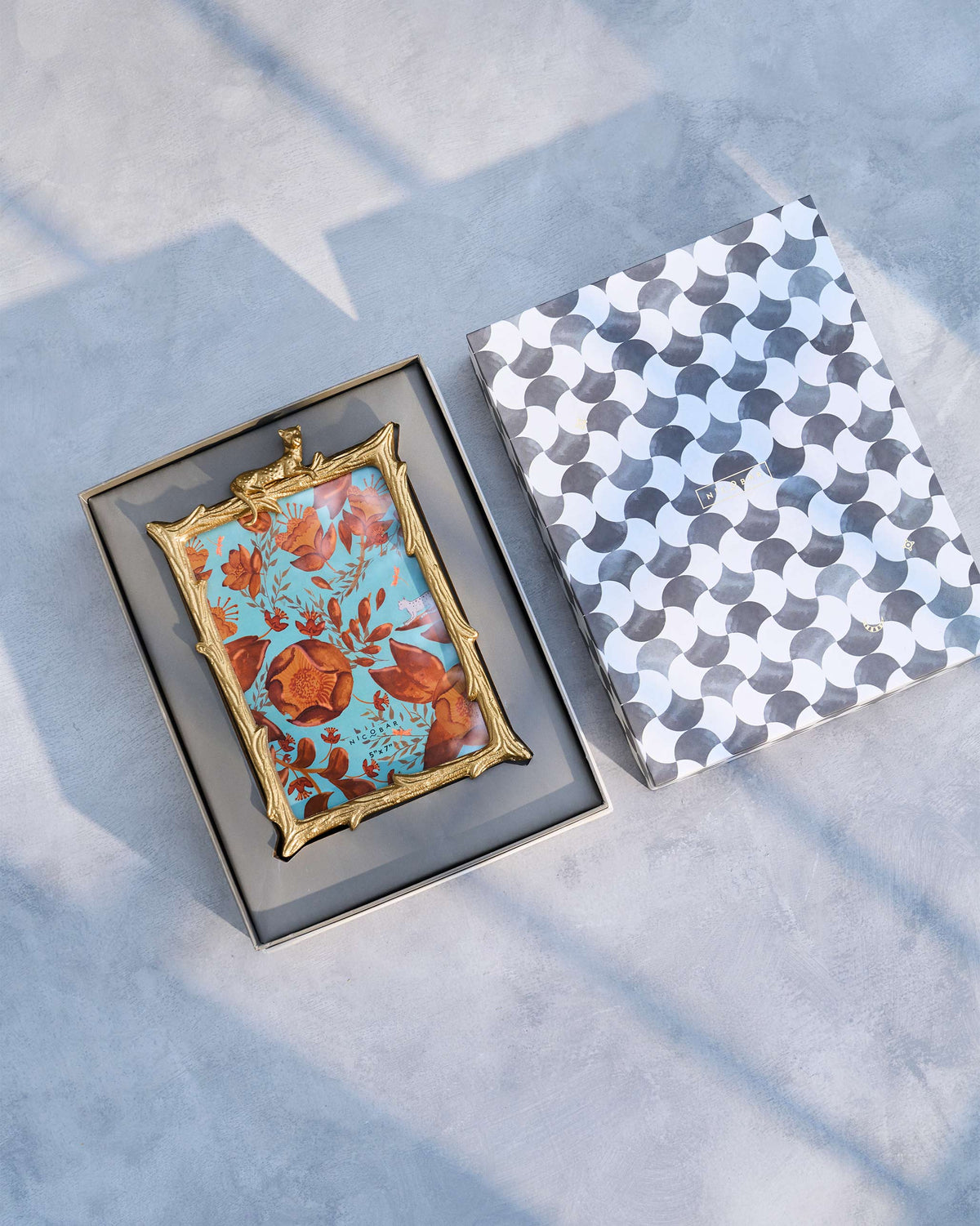 Jozani photo frame packed in its open Nicobar gift box.