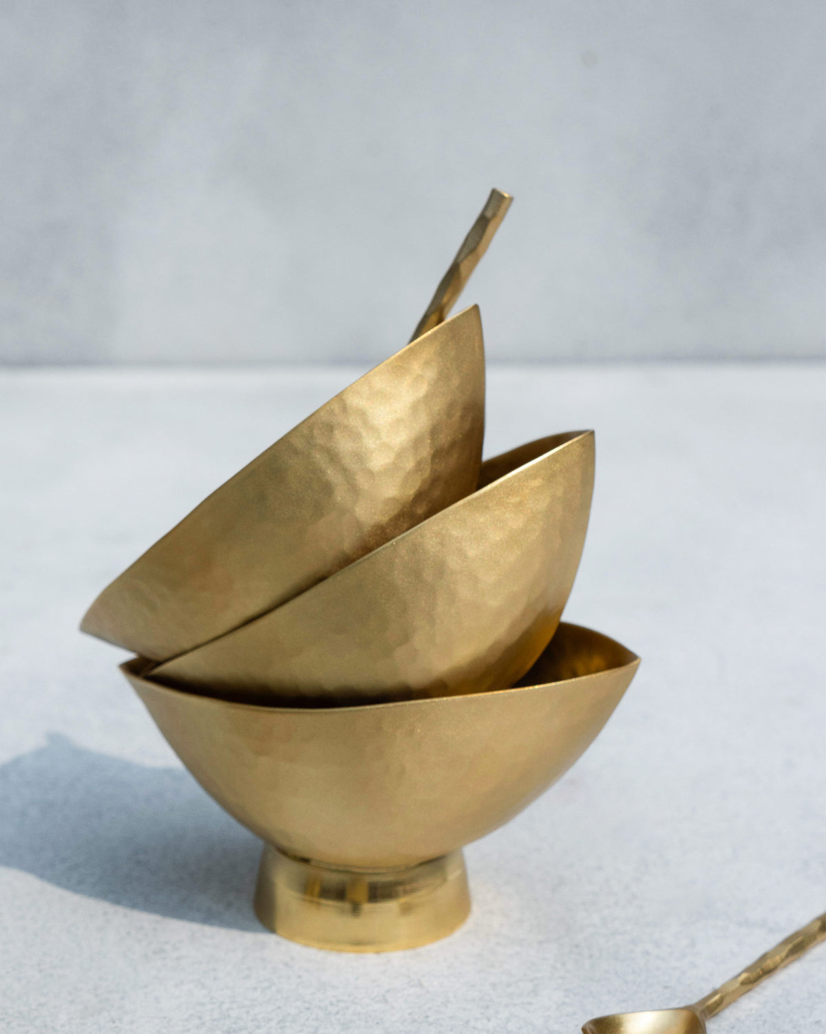 Stacked Chakra Gelato Cups showing a hammered gold finish.