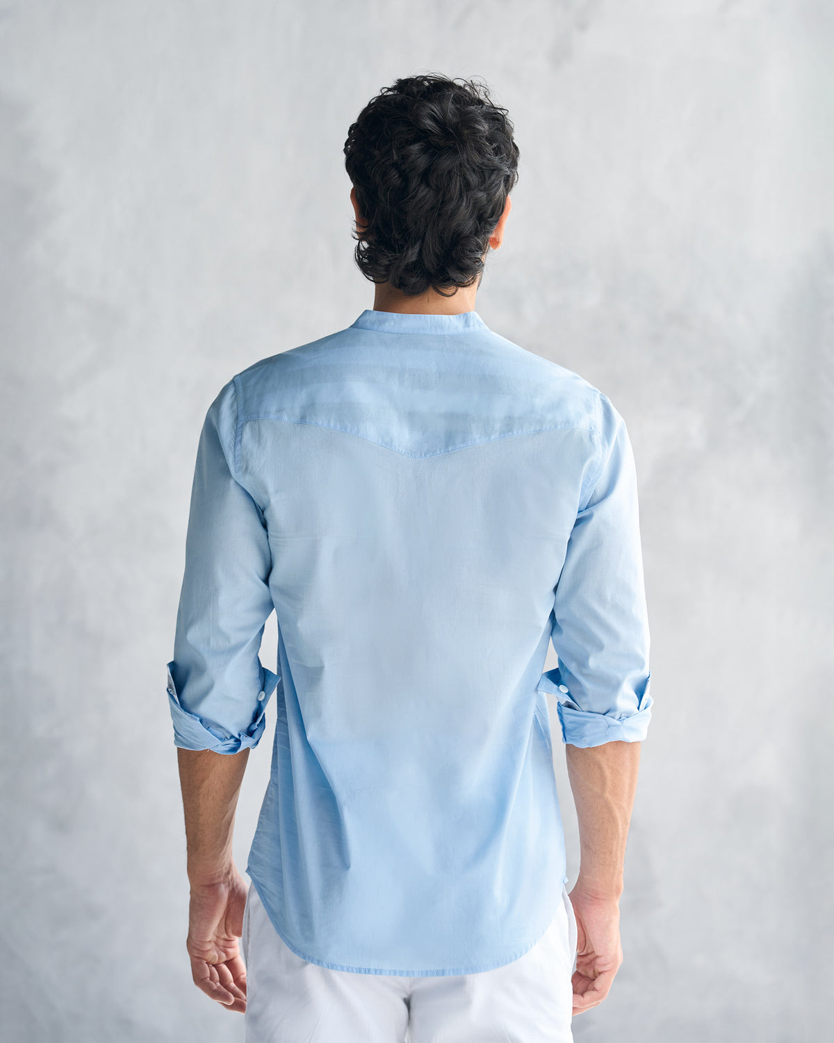 Back of a light blue Pondicherry shirt showing the yoke seam.