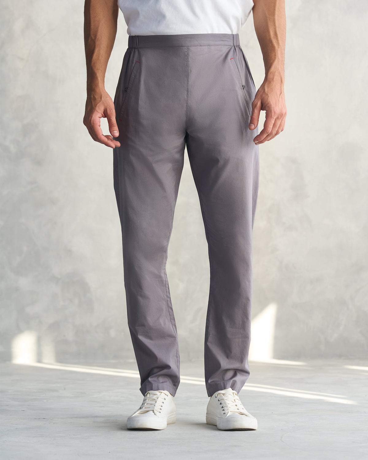 Person wearing charcoal Kurta Pants with a clean flat front.