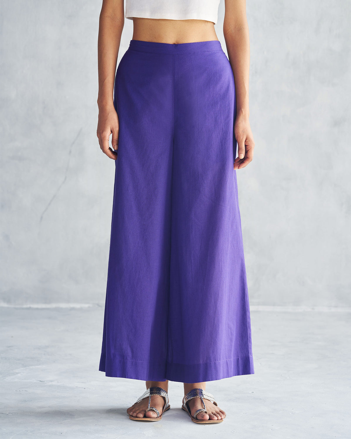 Person wearing purple Basic Pyjamas with wide legs.