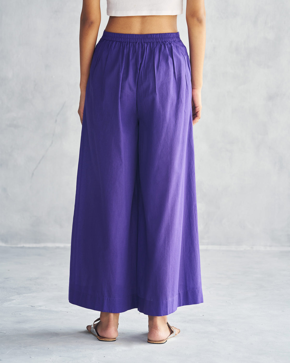 Back of purple Basic Pyjamas worn by a person.