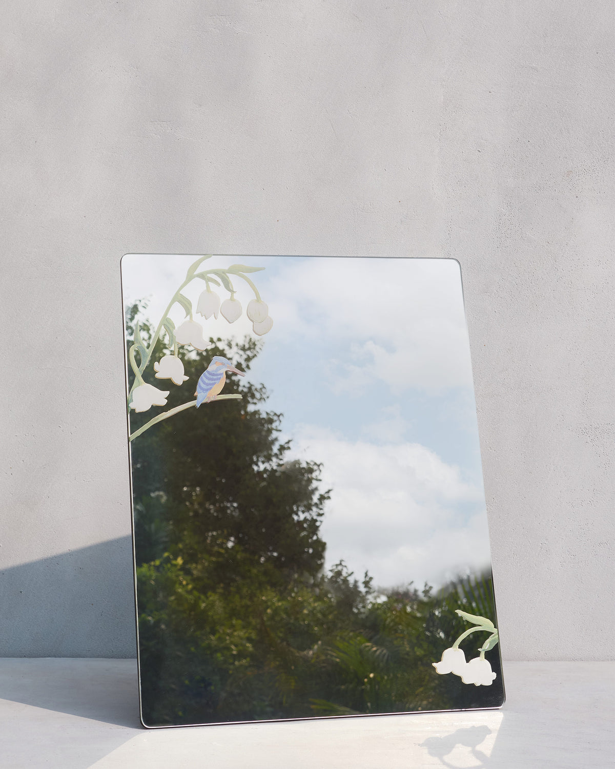Kingfisher Mirror with a kingfisher and white lily-of-the-valley motif.