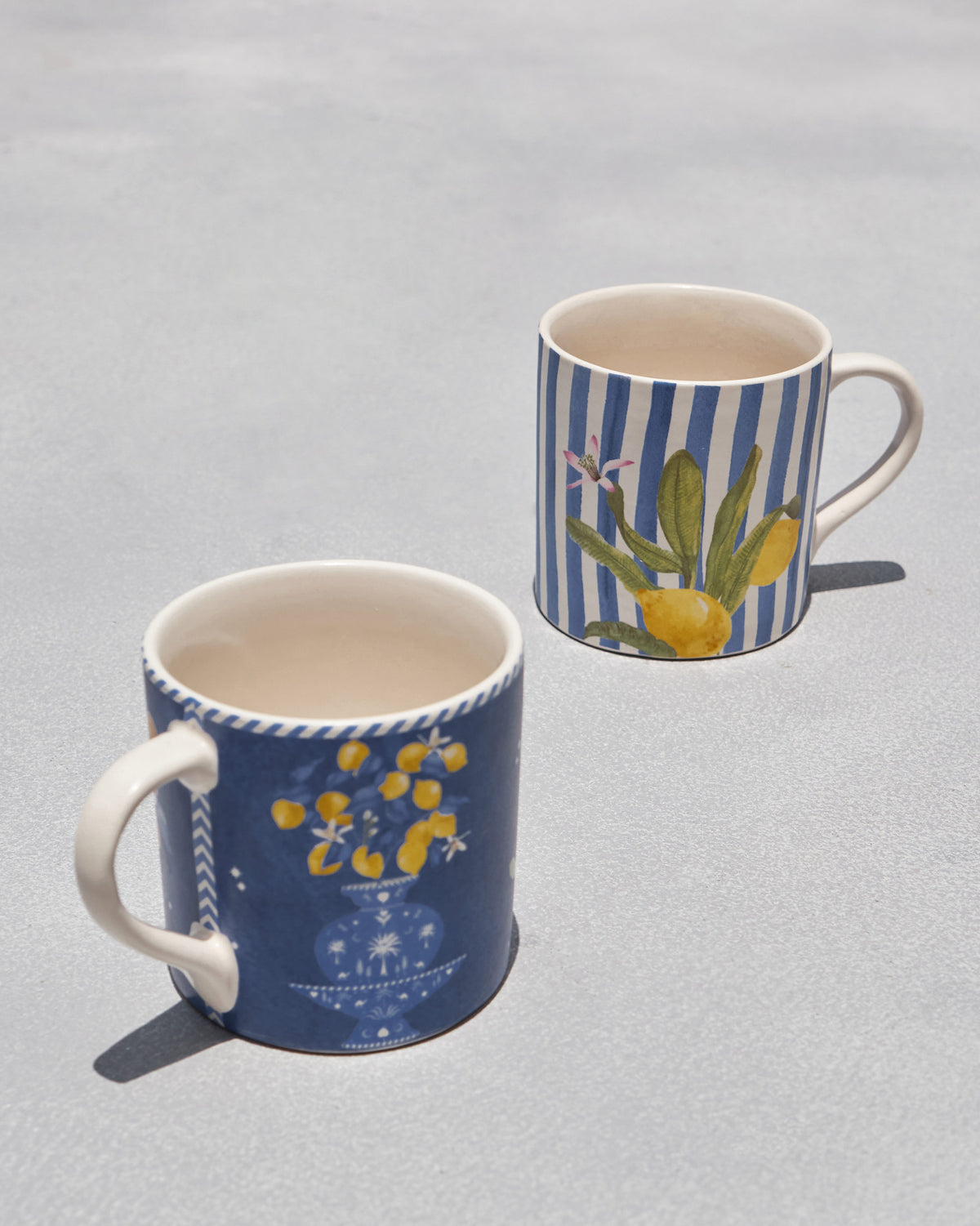 Looking into Asfar mugs with lemon urn and lemon branch illustrations.