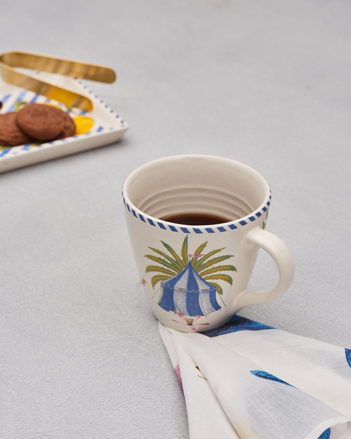 Sahara conical mug filled with a hot drink.