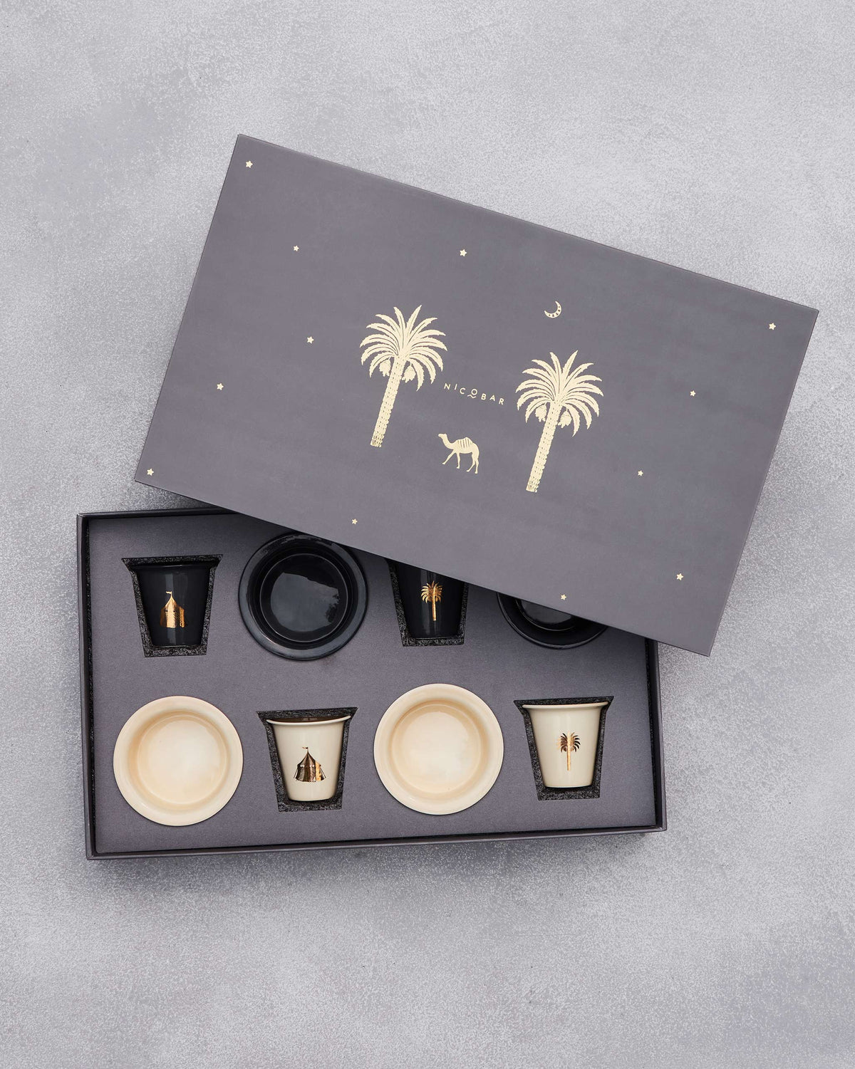 Sahara filter coffee set with its lid tipped back, cups still inside.