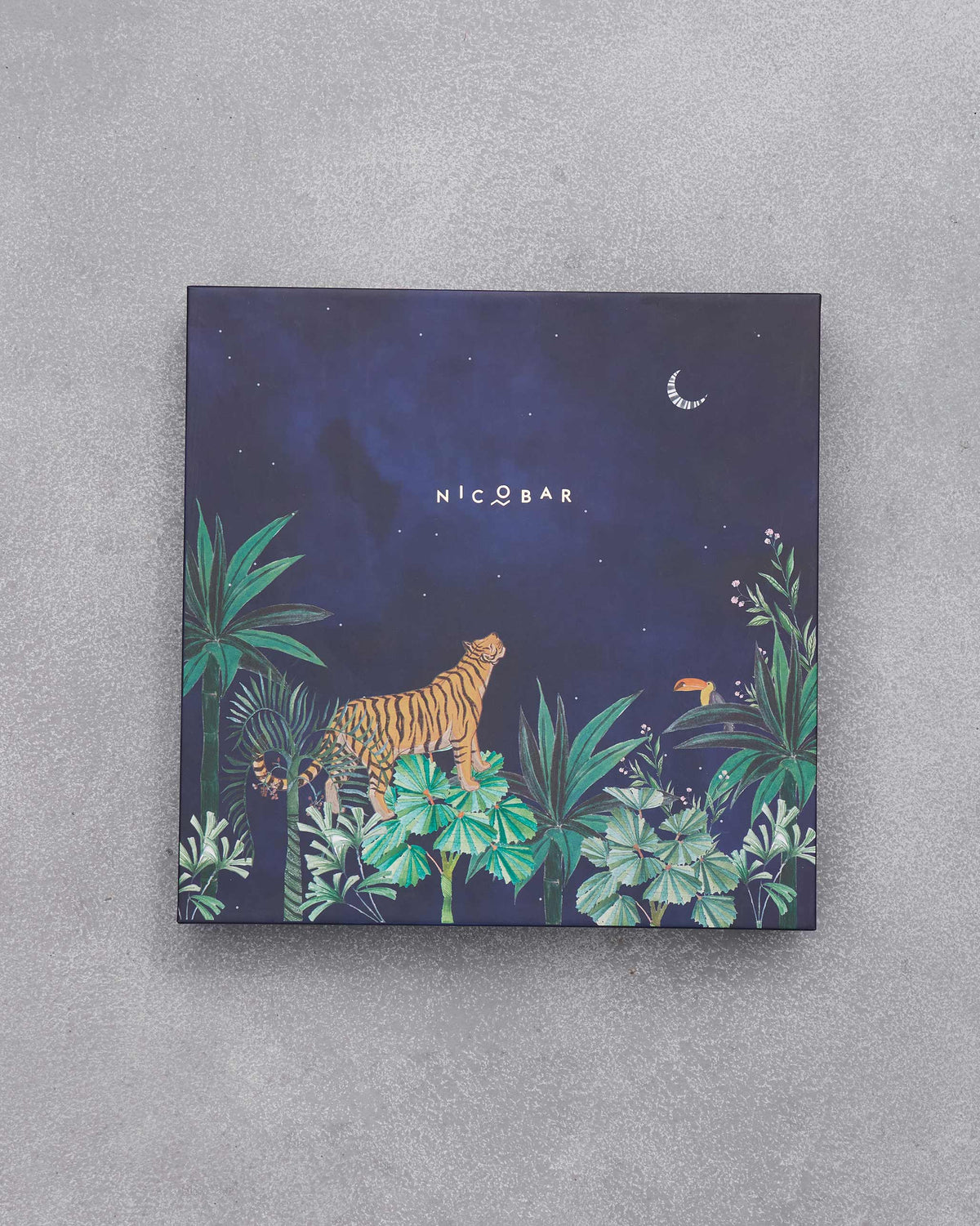 Closed navy box of the Sahara cheese board set with a tiger illustration.