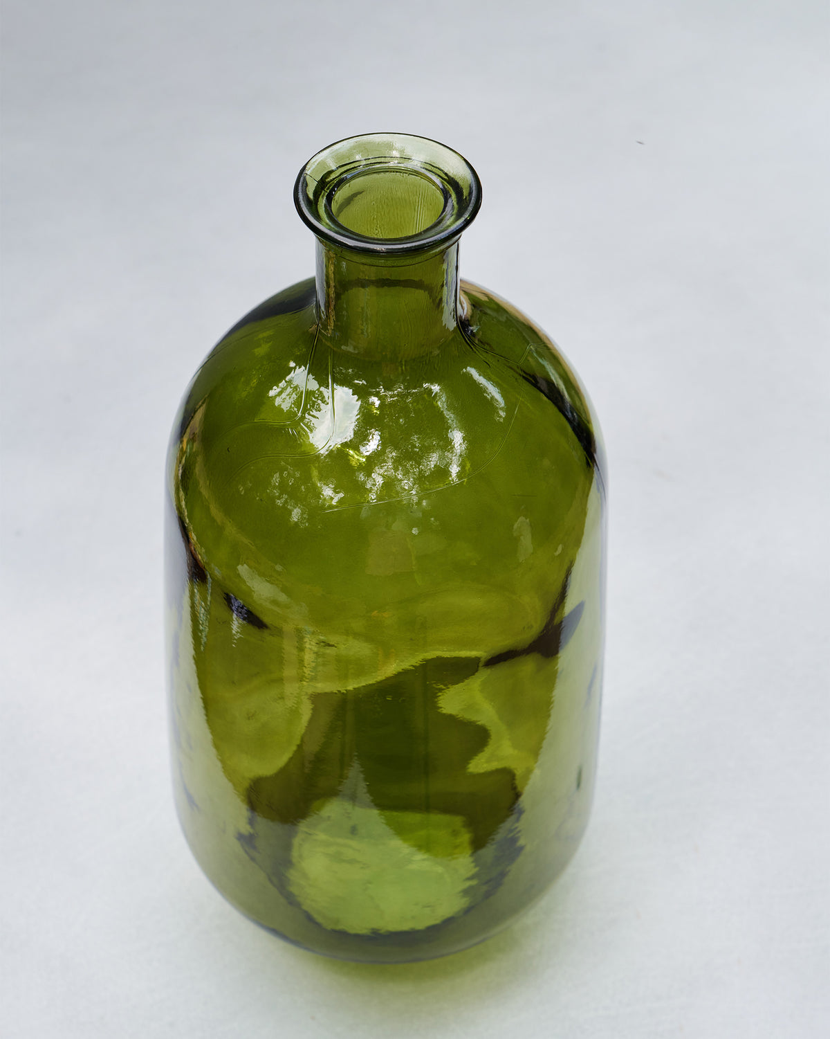 High-angle view of the Jade Glass Vase showing its rounded green body and opening.