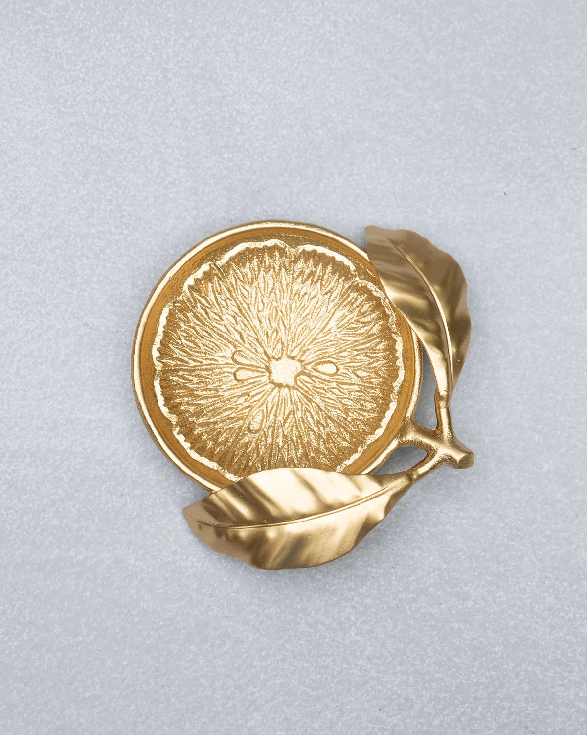 Gold Lemon Trinket Tray with embossed citrus pulp and stem leaves.