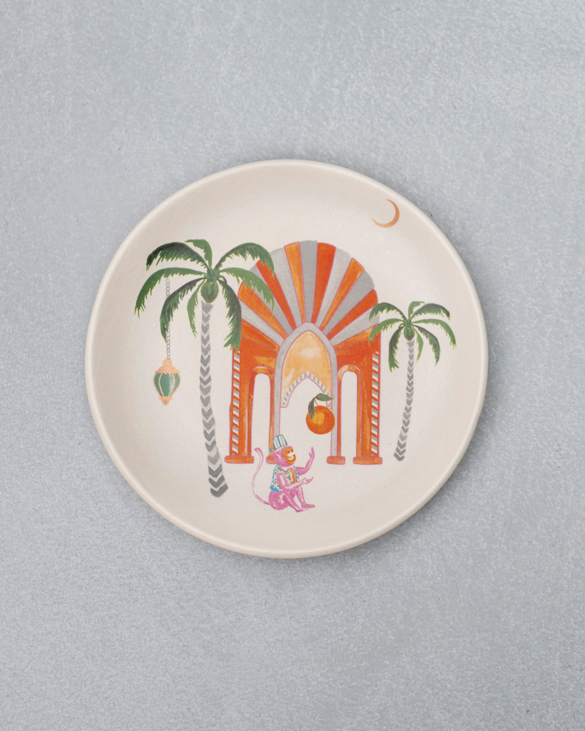 Mirage quarter plate with palm trees and an orange arch motif.