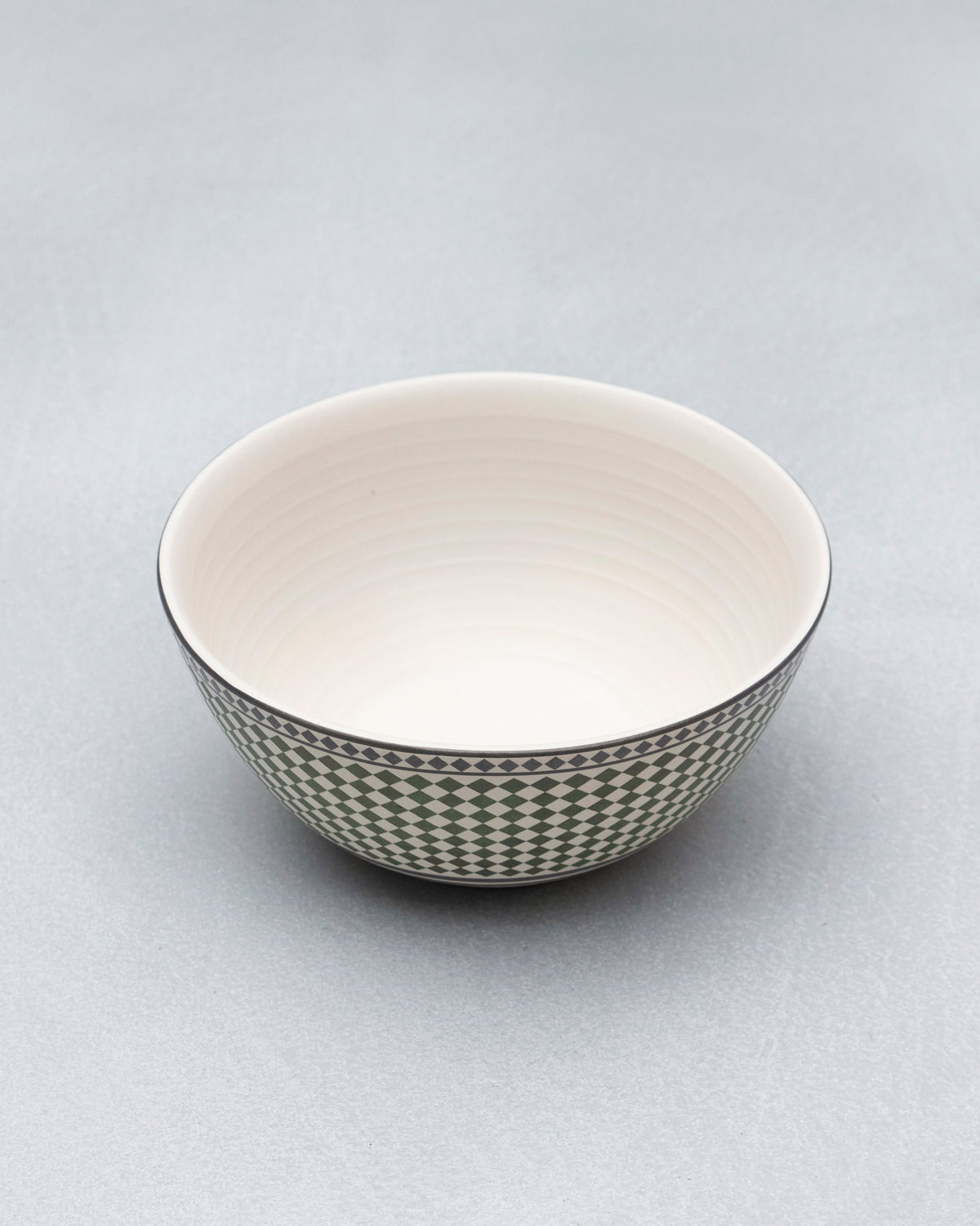 Zellij Serving Bowl with a green diamond checkered band and a cream interior.