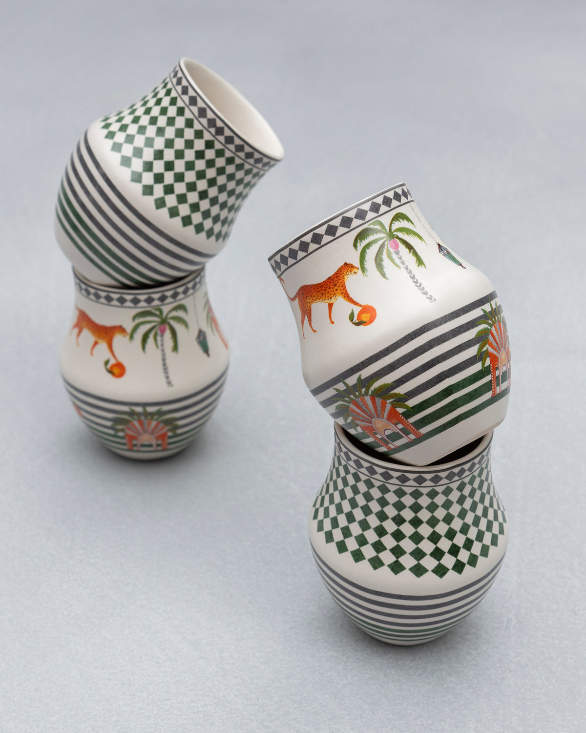 Dessert Palm Kulhars tilted together, showing tiger and palm designs.