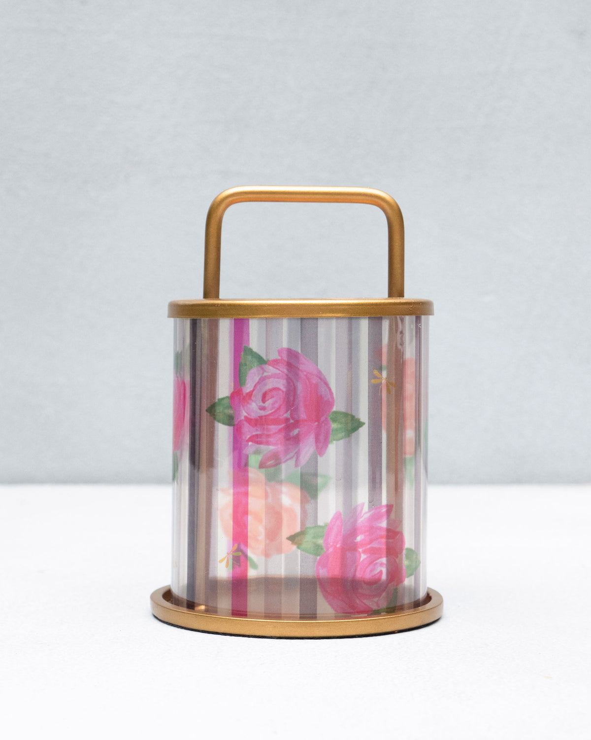 Striped Roses lantern with a gold U-shaped handle and rose print.