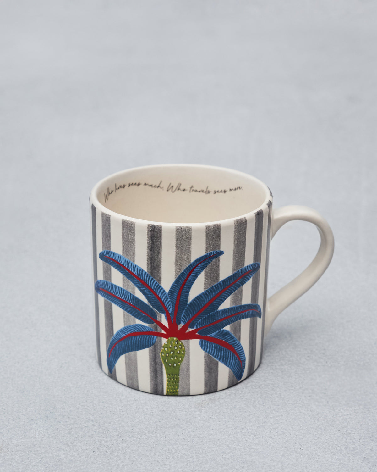 Dancing Palm Straight Mug with grey stripes, a blue palm motif, and a quote inside.