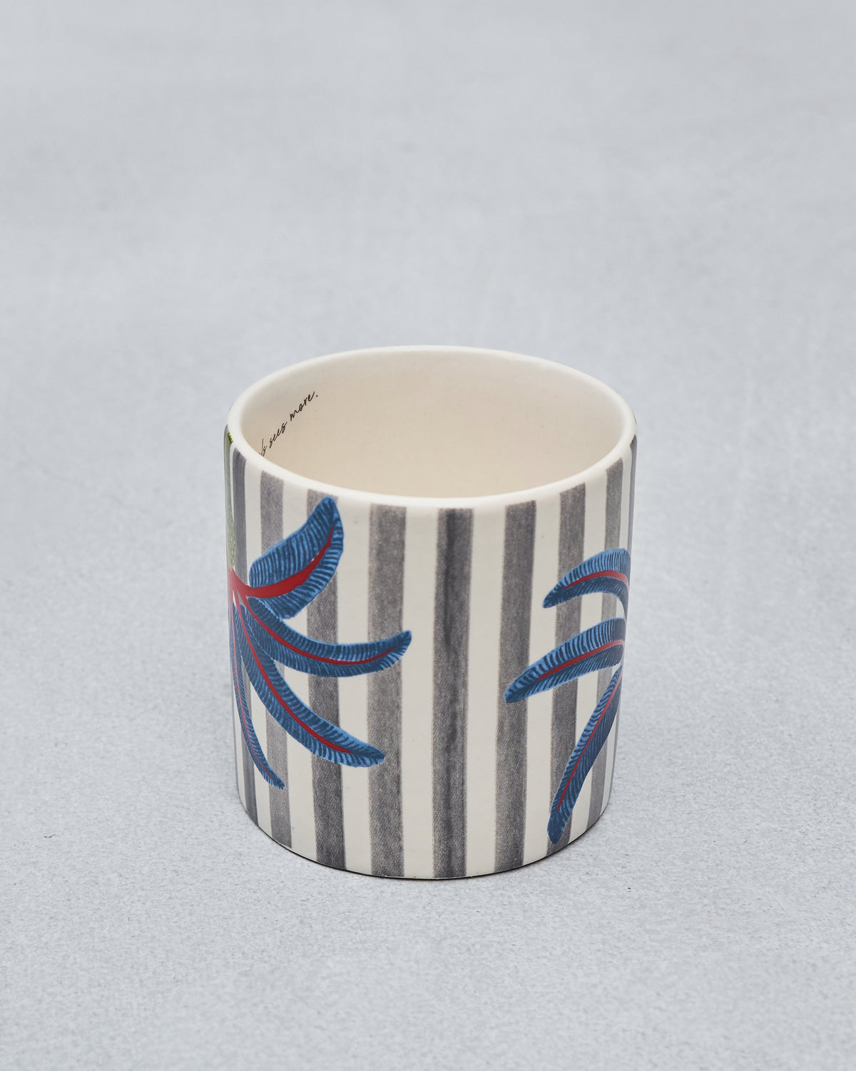 Side of a Dancing Palm Straight Mug showing grey stripes and blue palm fronds.