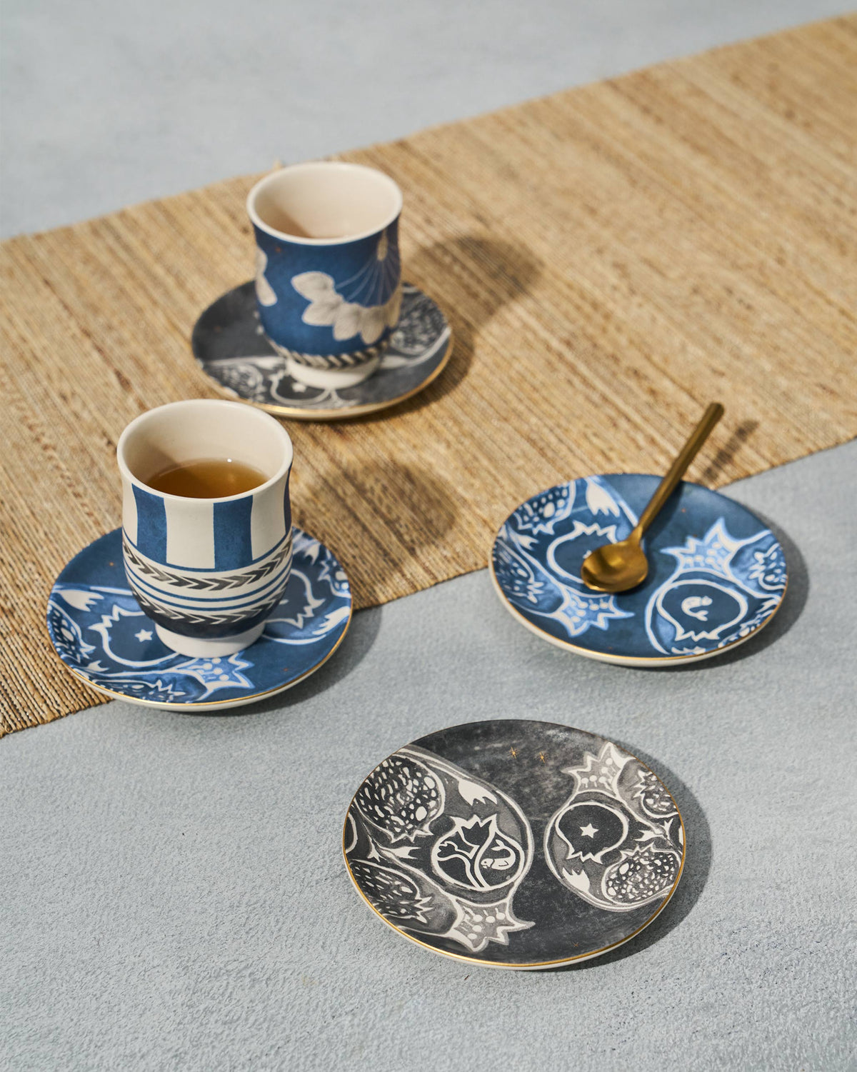 Desert Trail Tea Plates with pomegranate motifs styled for tea service.