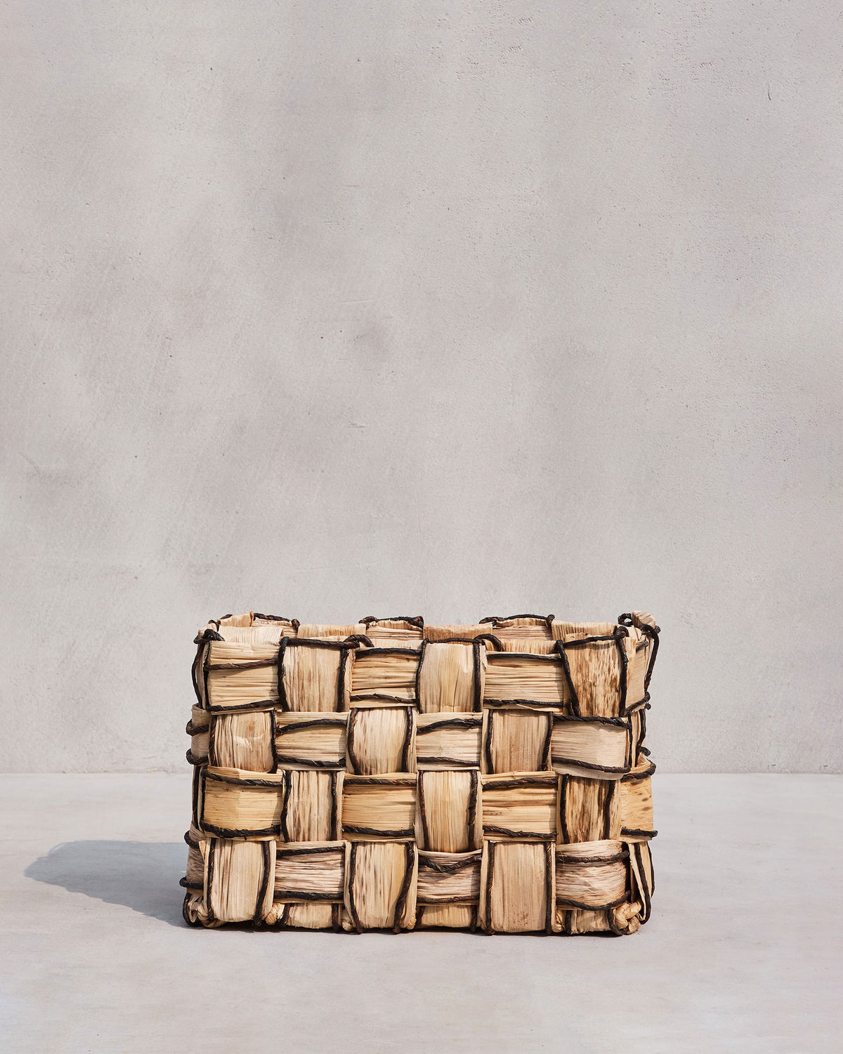 Small Mosaic basket in beige abaca with a dark brown grid weave.