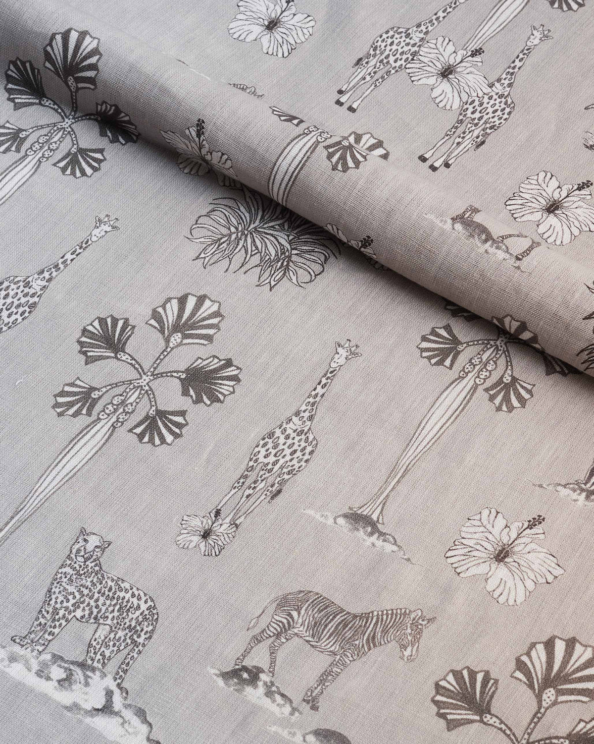 Grey Tile fabric printed with giraffes, zebras and hibiscus flowers.