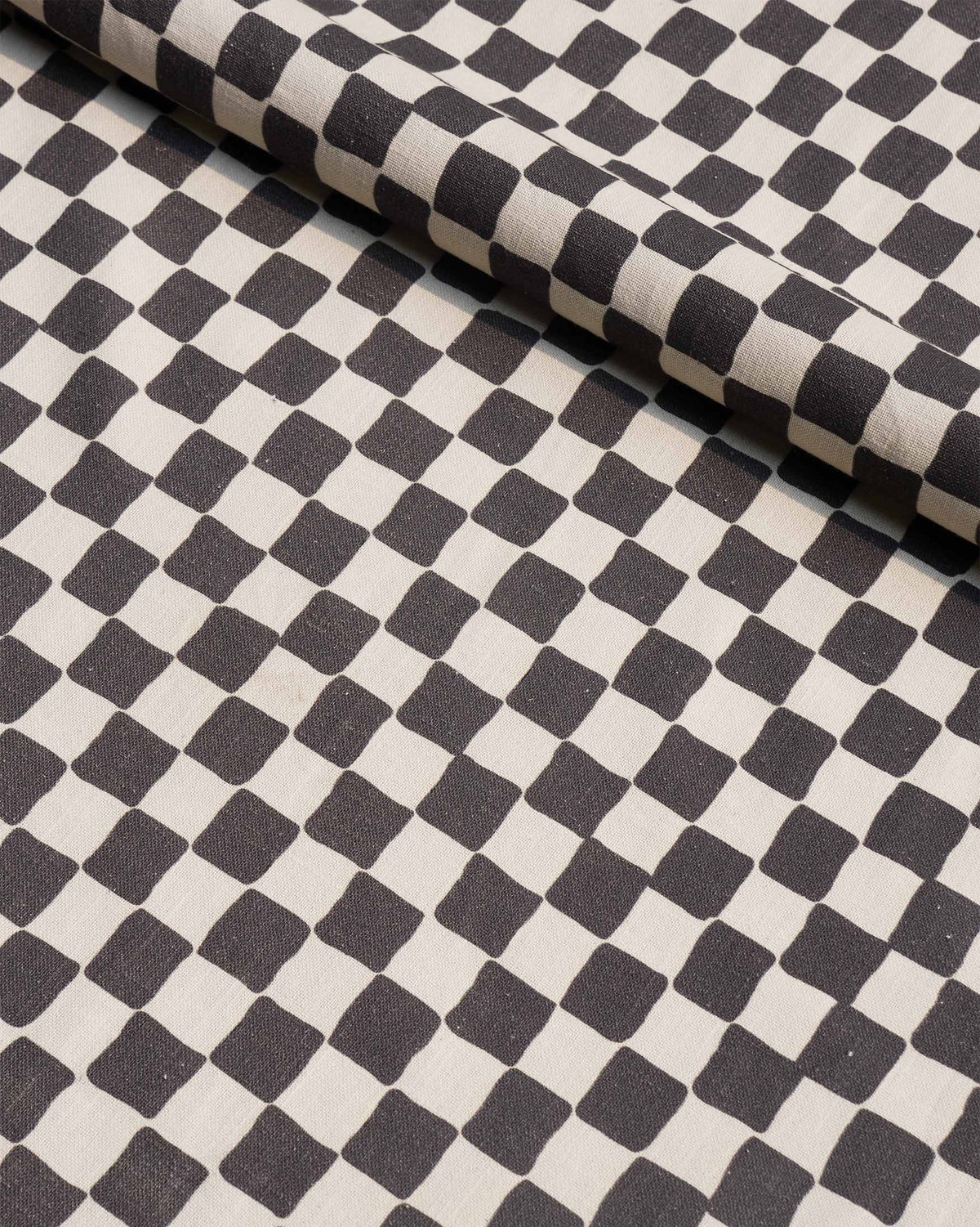 Fez fabric in a black and cream checkerboard print.